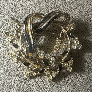 Elegant Gold and Black Brooch